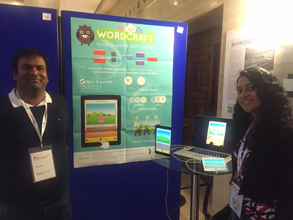 two people presenting poster