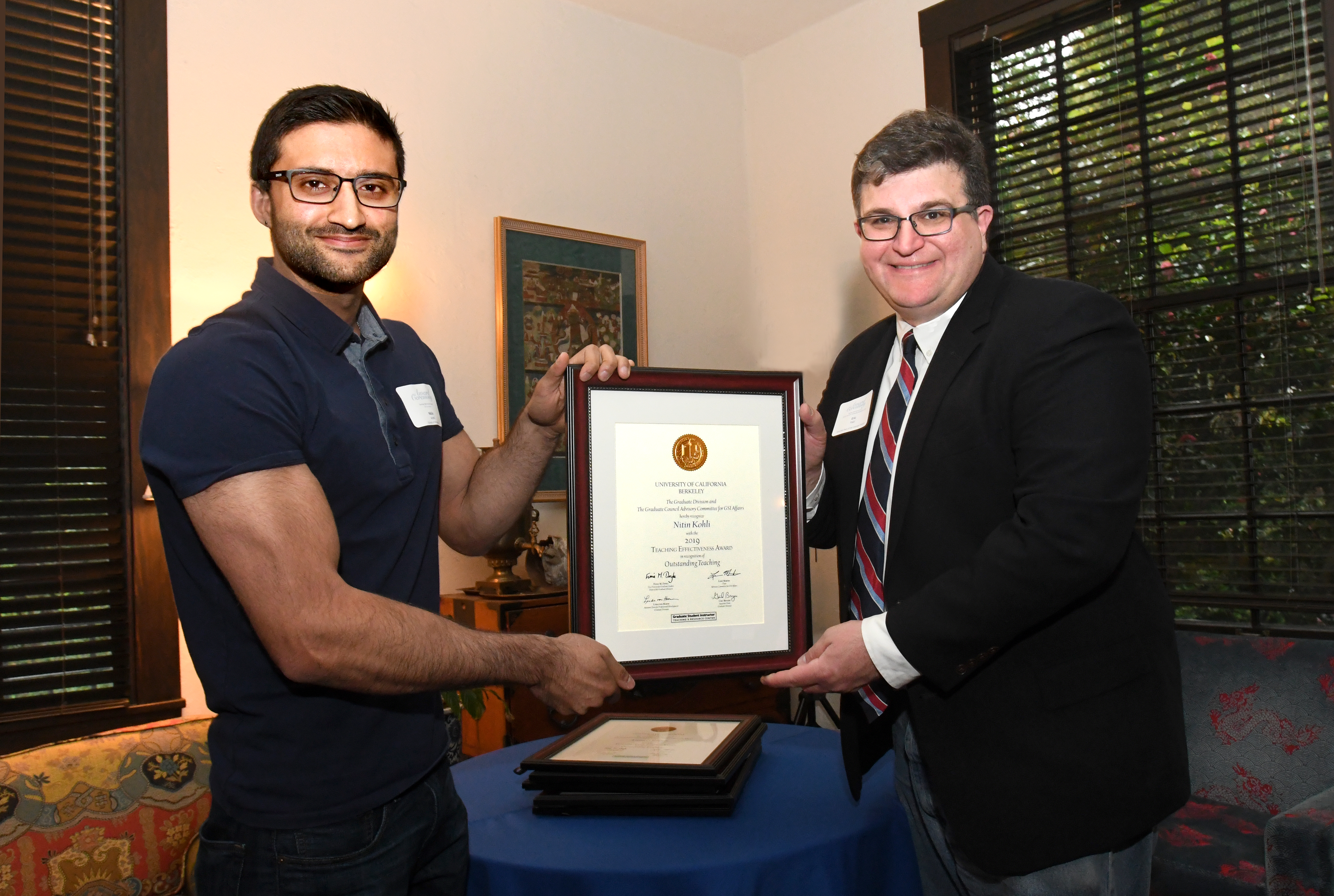 Nitin Kohli and Associate Dean of Graduate Division Eric Falci.