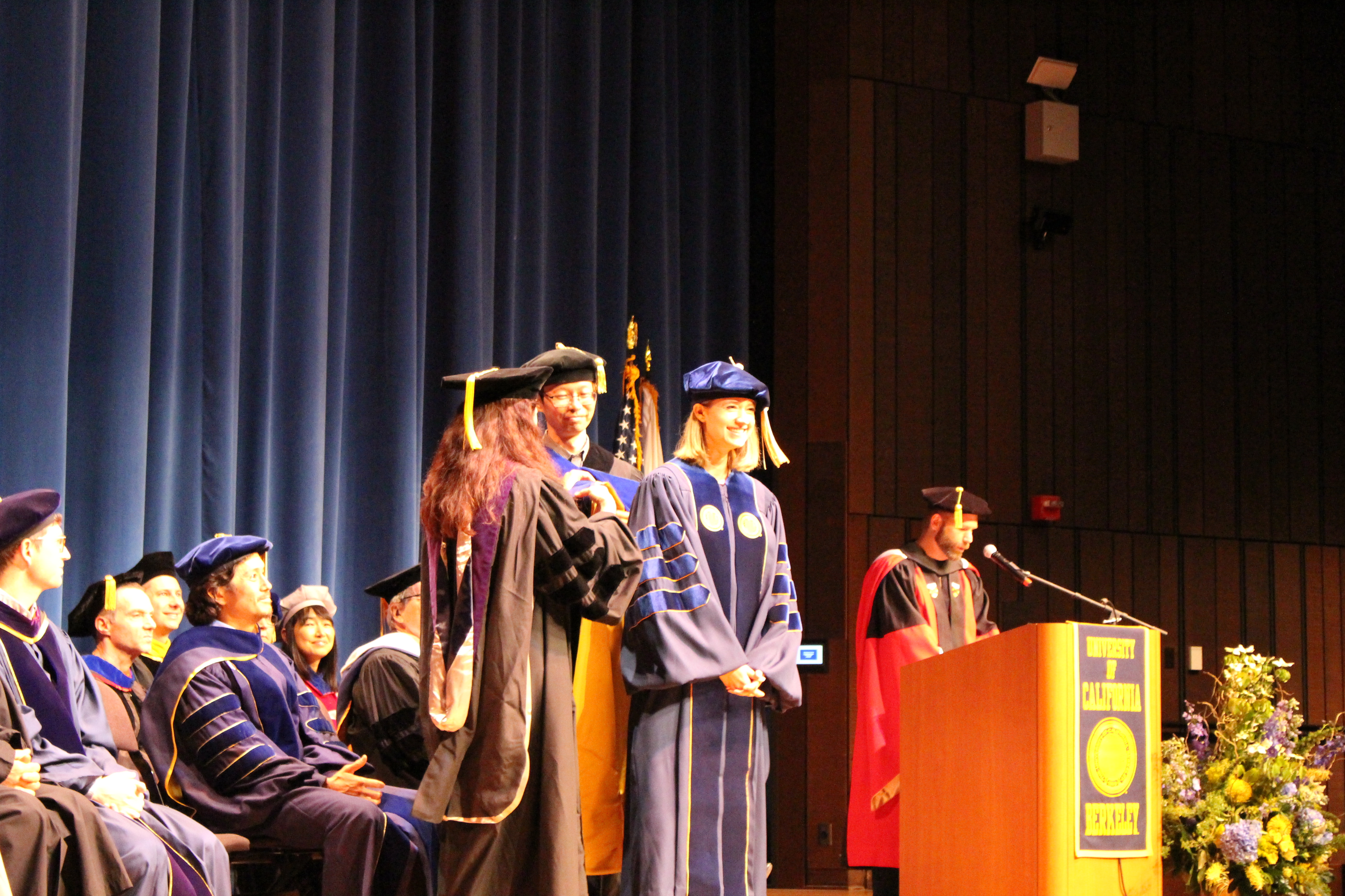 Elaine Sedenberg is hooded by her advisors Deirdre Mulligan and John Chuang