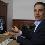 Hany Farid gestures as he views video clips in his office at South Hall in UC Berkeley
