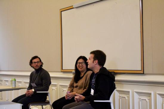 three people sitting on a panel