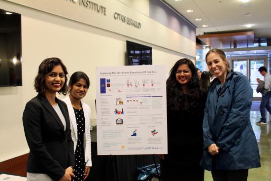3 MIMS students with their advisor, Professor Burrell, and their project poster