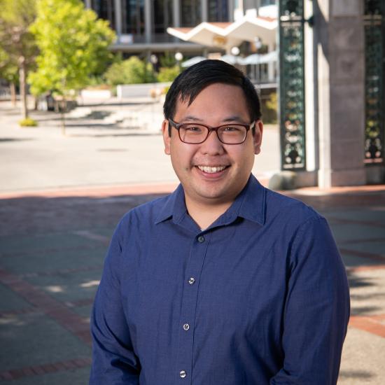photo of Richmond Wong, smiling, on the UC Berkeley campus near Sather Gate
