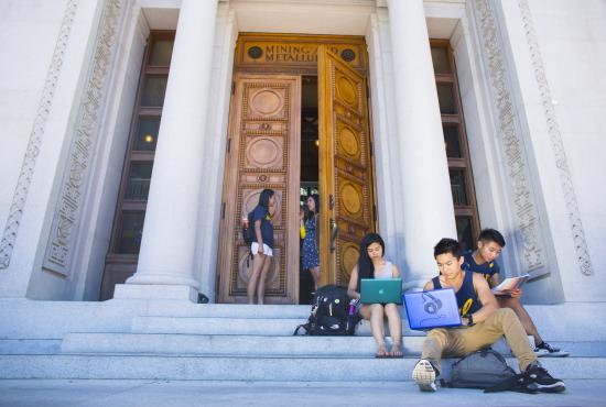 studnets sitting on steps at UC Berkeley