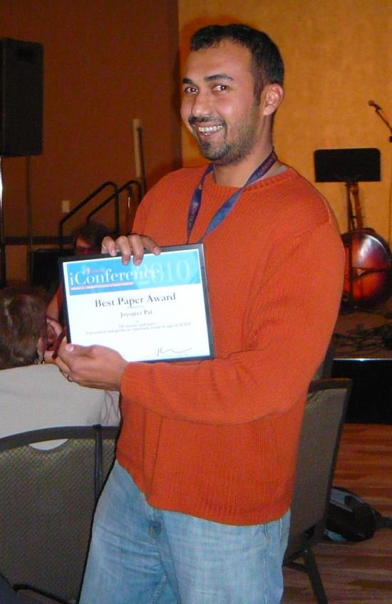 Joyojeet Pal with his "Best Paper" award from the 2010 iConference