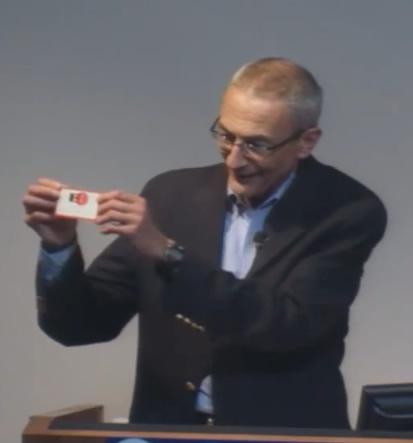 John Podesta shows off his EFF membership card, which shows that he was Member #33.