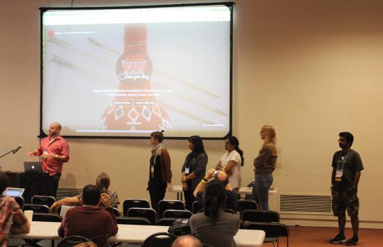 The I School team presents their project to the hackathon judges and audience.